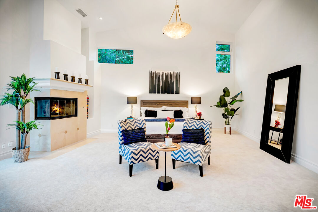 16561 Adlon Road Encino, CA 91436 - Photo 45 of 75 a living room with furniture and a fireplace