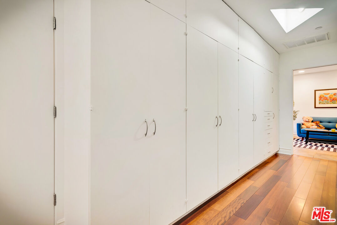 16561 Adlon Road Encino, CA 91436 - Photo 59 of 75 a view of a hallway with wooden floor
