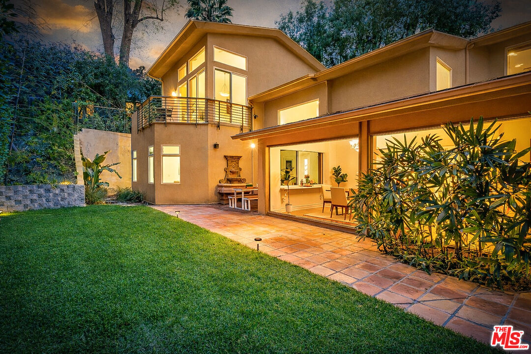 16561 Adlon Road Encino, CA 91436 - Photo 66 of 75 a view of an house with backyard space and balcony