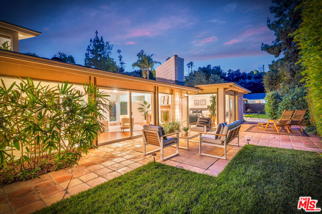 16561 Adlon Road Encino, CA 91436 - Photo 68 of 75 a view of a swimming pool with outdoor seating