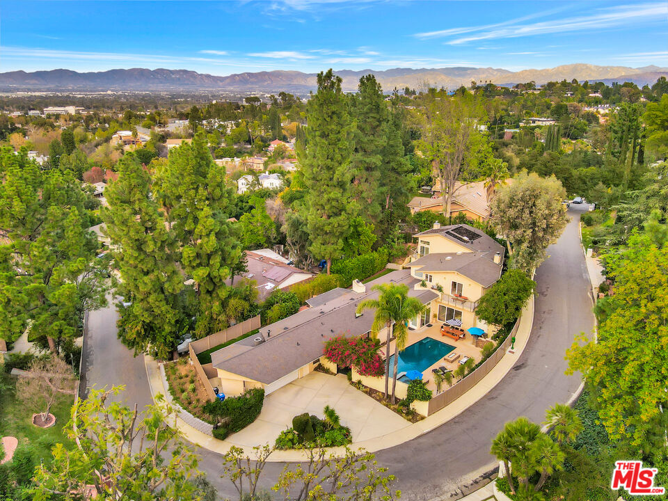 16561 Adlon Road Encino, CA 91436 - Photo 73 of 75 an aerial view of residential houses with outdoor space and trees