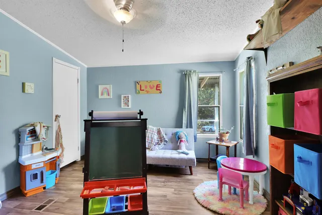 a bedroom with furniture and a chair