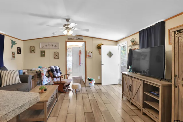 a living room with furniture and a flat screen tv