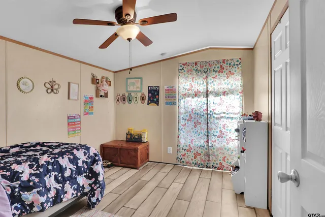 a bedroom with bed and a window