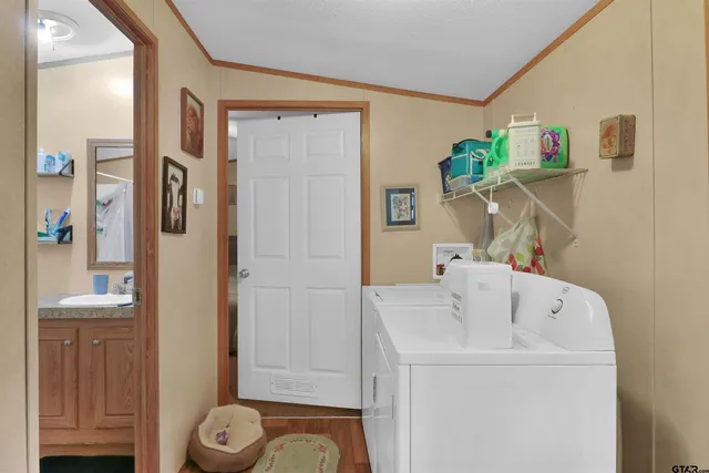 a bathroom with a bathtub sink and mirror