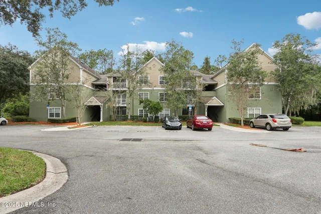 a view of a street with a building in the background