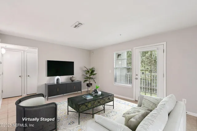a view of a kitchen with white cabinets