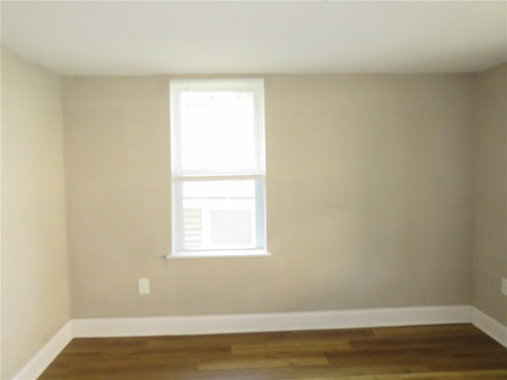 680 Hamilton Monroeville, PA 15146 - Photo 14 of 18 a view of a small space with wooden floor and a window