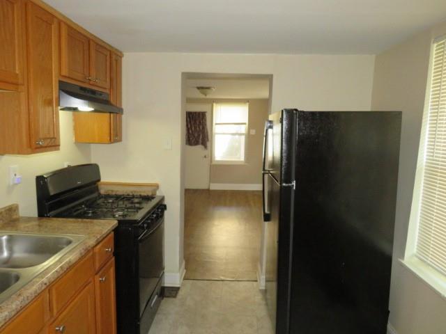 680 Hamilton Monroeville, PA 15146 - Photo 5 of 18 a kitchen with a refrigerator and a sink