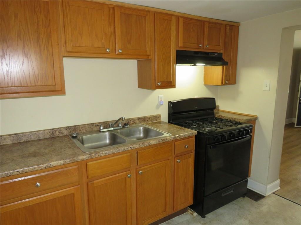 680 Hamilton Monroeville, PA 15146 - Photo 6 of 18 a kitchen with sink cabinets and a stove top oven