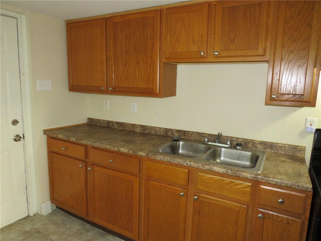 680 Hamilton Monroeville, PA 15146 - Photo 7 of 18 a kitchen with granite countertop cabinets sink and stove