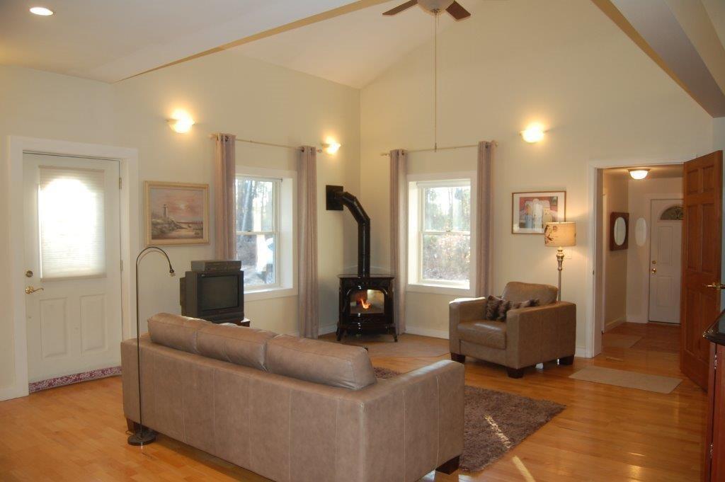 111 Wilson Pond Road North Monmouth, ME 04265 - Photo 4 of 33 LIVING ROOM WITH PELLET STOVE
