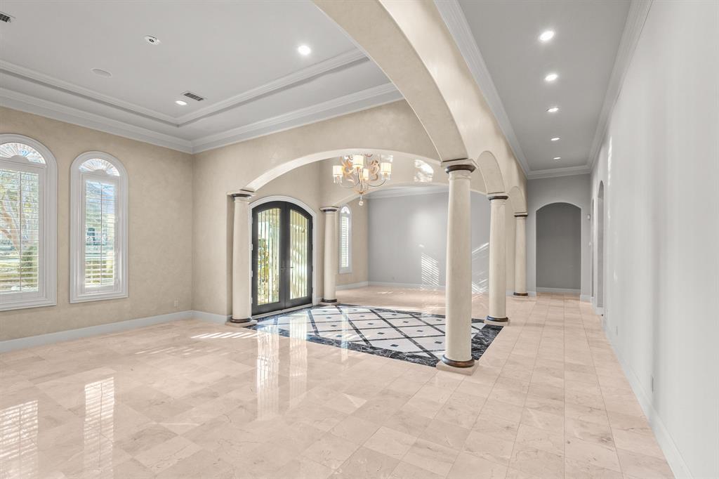 4624 Byron Circle Irving, TX 75038 - Photo 14 of 39 a view of a big room with windows and chandelier