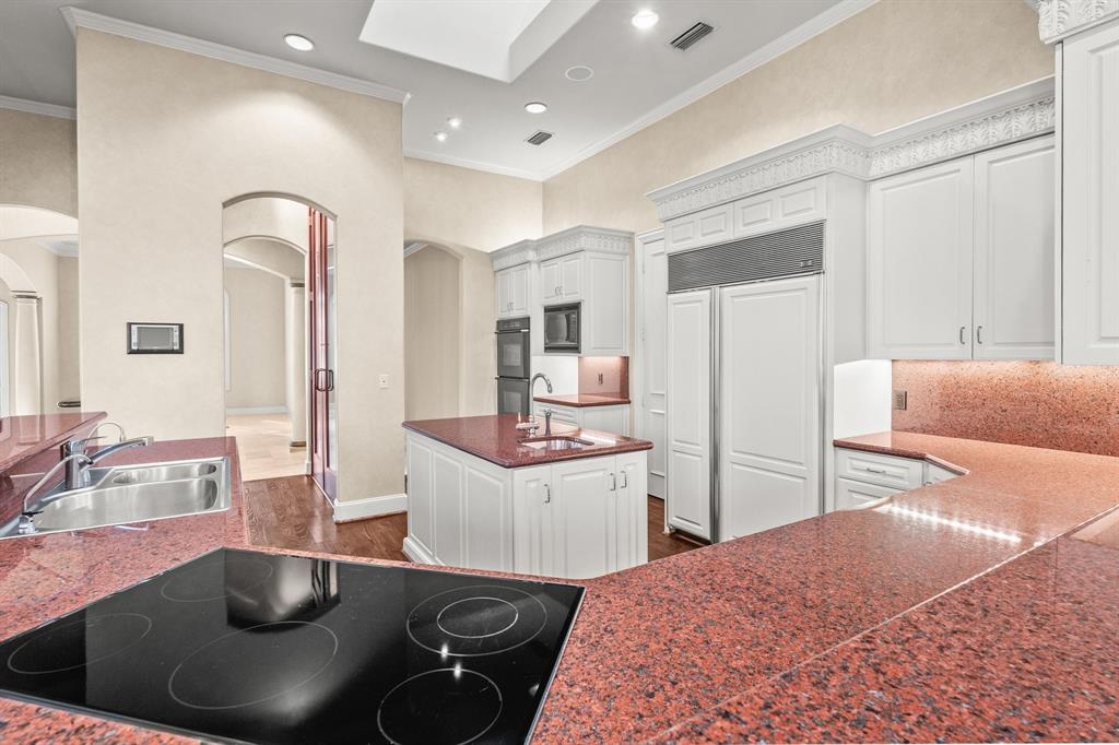 4624 Byron Circle Irving, TX 75038 - Photo 18 of 39 a kitchen with stainless steel appliances granite countertop a sink and cabinets