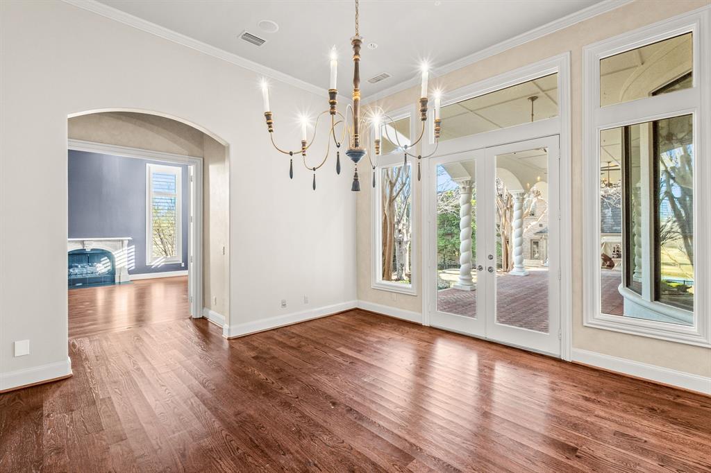 4624 Byron Circle Irving, TX 75038 - Photo 19 of 39 a view of a big room with wooden floor and windows