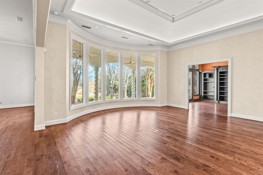 4624 Byron Circle Irving, TX 75038 - Photo 21 of 39 wooden floor in an empty room with a window