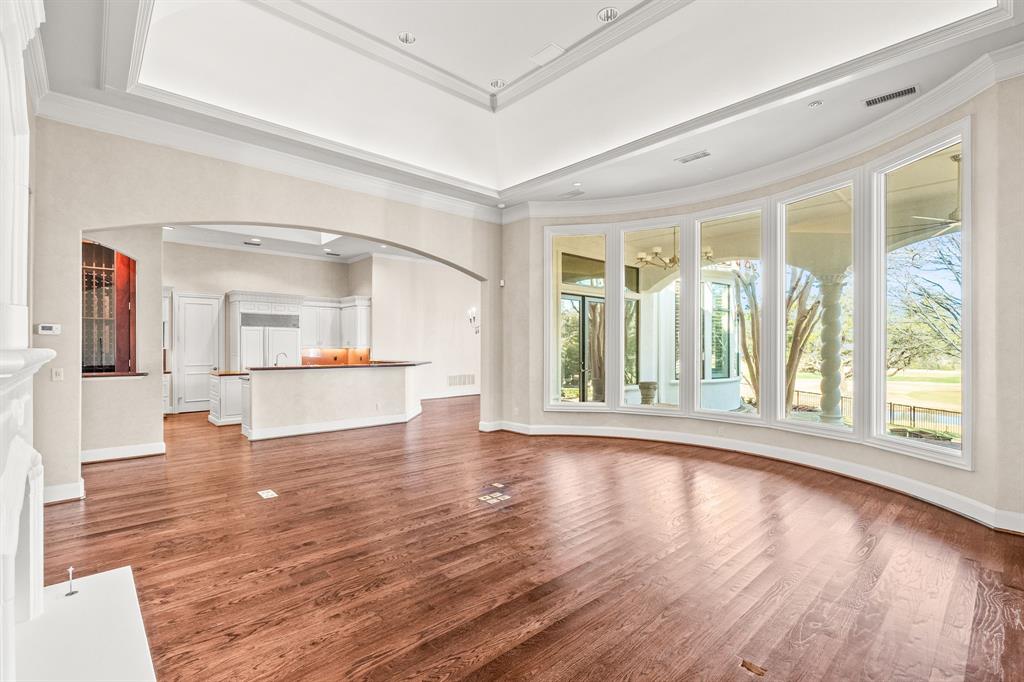 4624 Byron Circle Irving, TX 75038 - Photo 22 of 39 wooden floor in an empty room with a window