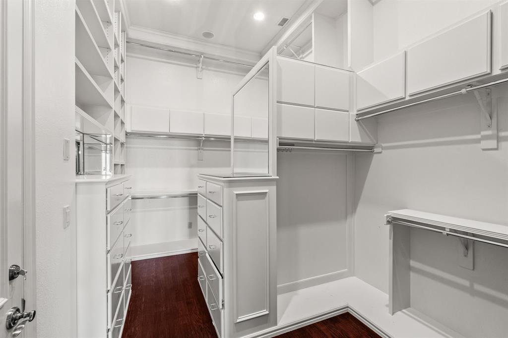 4624 Byron Circle Irving, TX 75038 - Photo 30 of 39 a view of walk in closet with empty racks