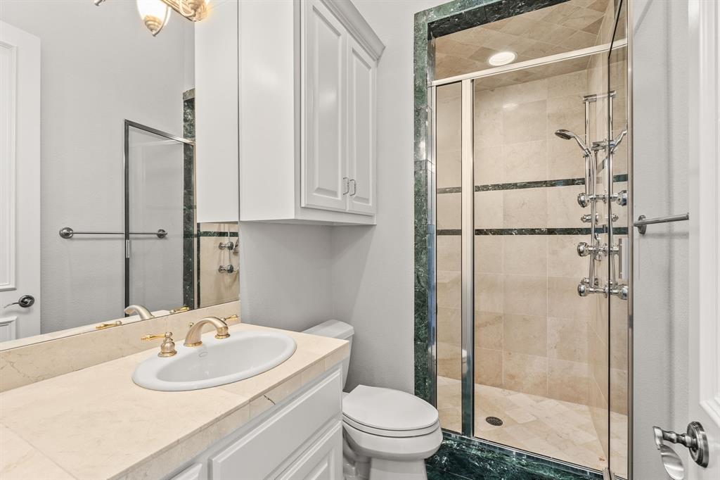 4624 Byron Circle Irving, TX 75038 - Photo 32 of 39 a bathroom with a sink toilet and shower