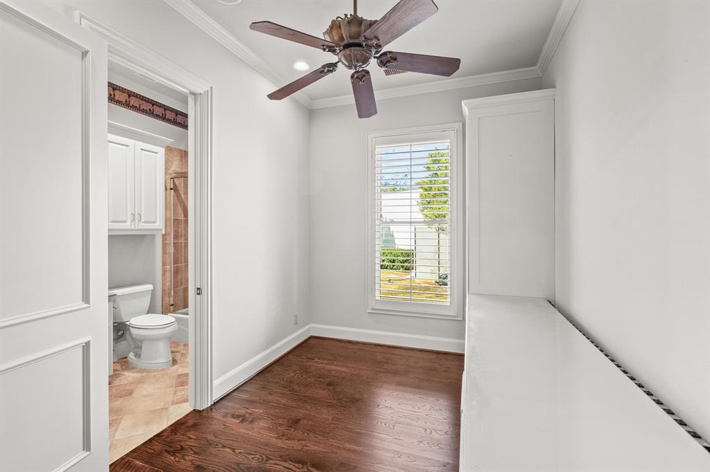 4624 Byron Circle Irving, TX 75038 - Photo 34 of 39 a view of a bathroom with a hardwood floor and a ceiling fan