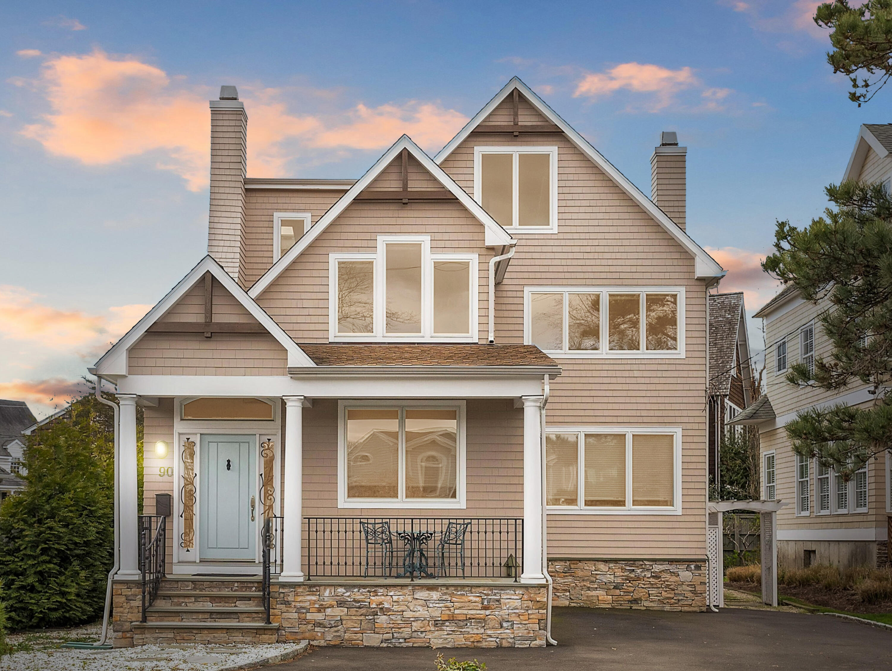 a front view of a house with a street