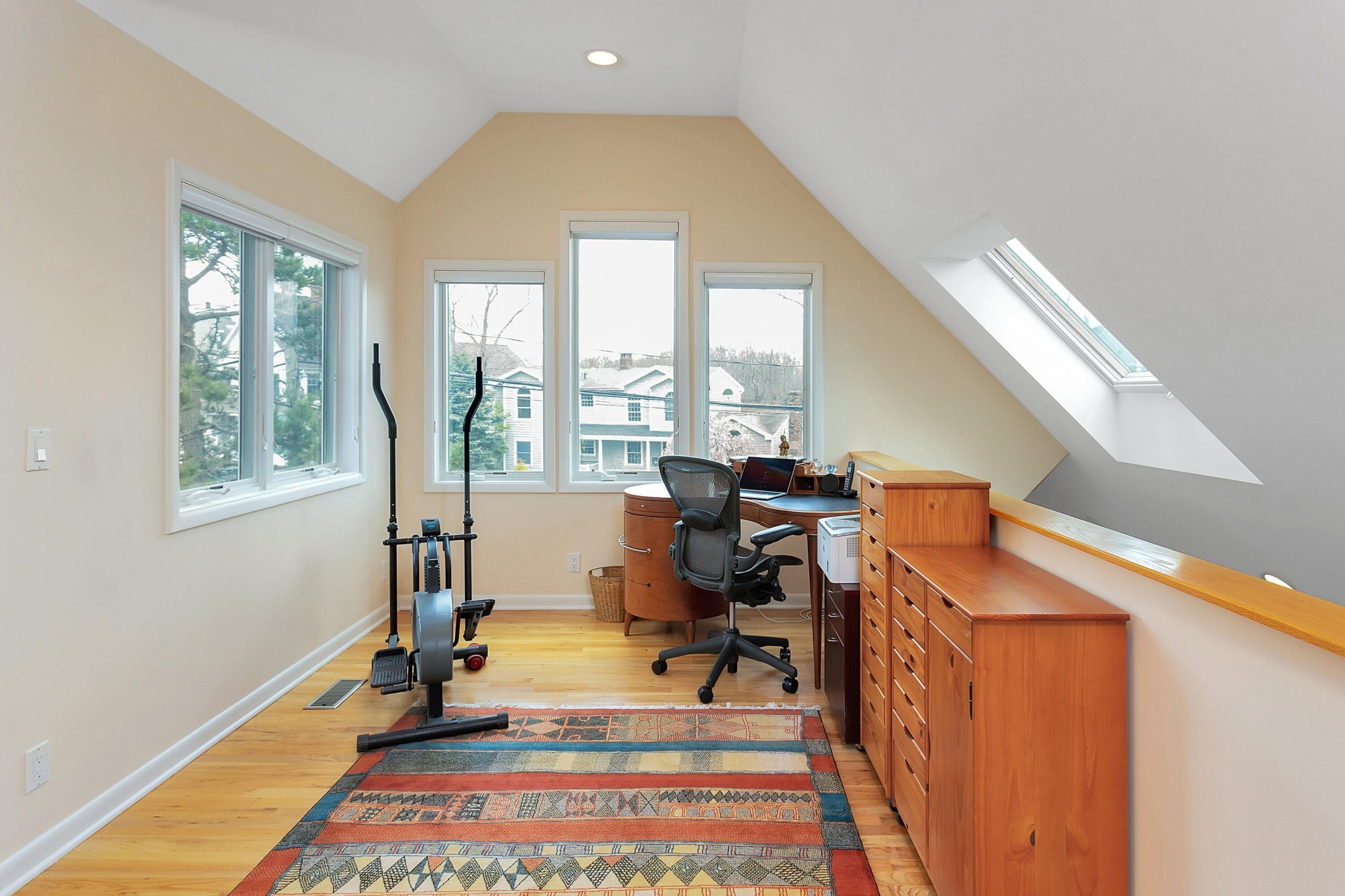 90 Roton Avenue Norwalk, CT 06853 - Photo 17 of 33 a view of a workspace with furniture and a window