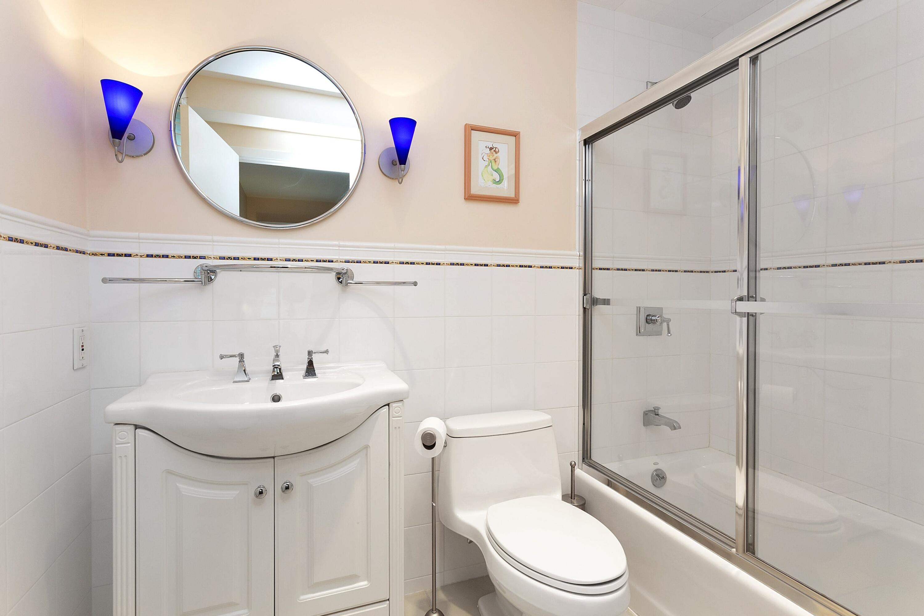 90 Roton Avenue Norwalk, CT 06853 - Photo 21 of 33 a bathroom with a sink mirror toilet and shower