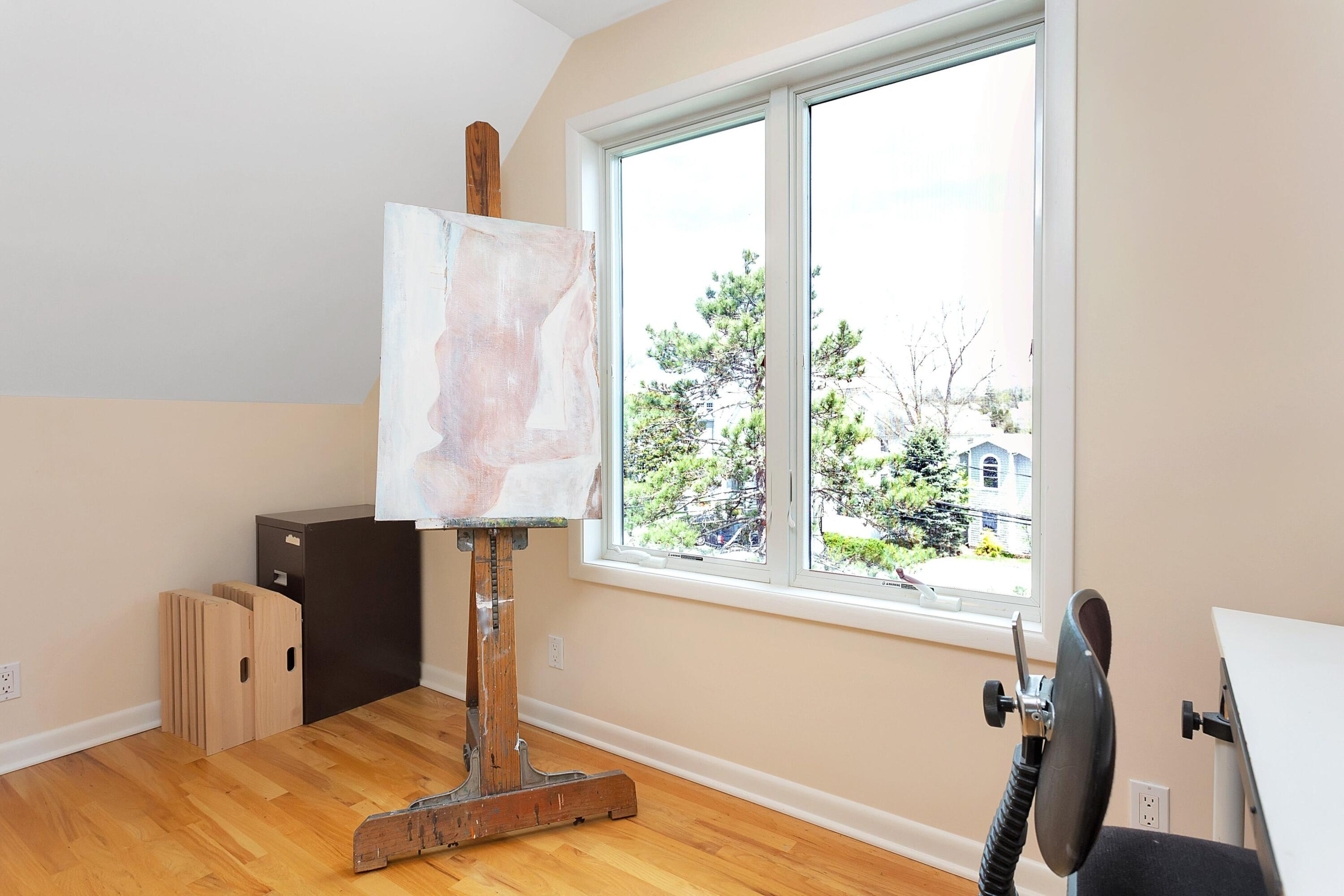 90 Roton Avenue Norwalk, CT 06853 - Photo 24 of 33 a view of a room with a window and a bed