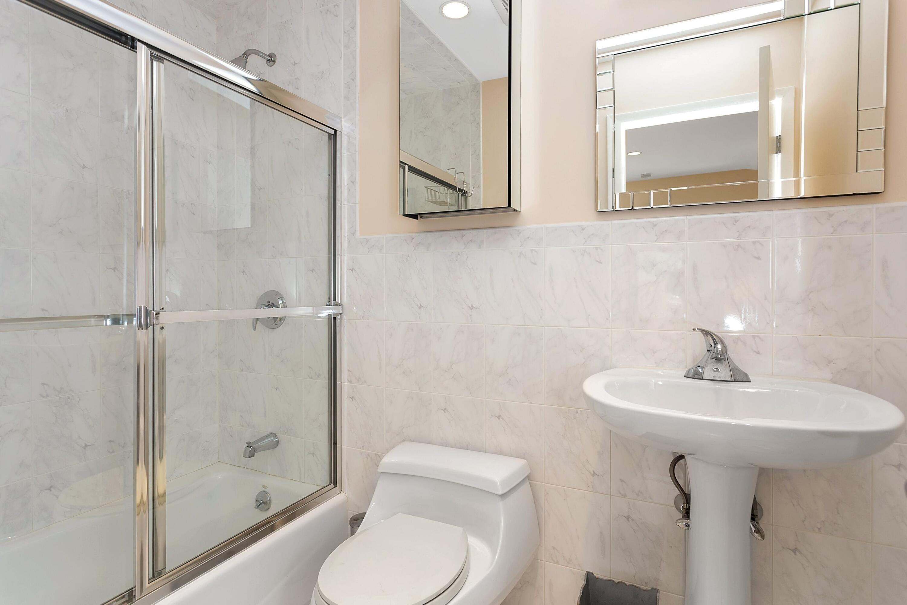 90 Roton Avenue Norwalk, CT 06853 - Photo 25 of 33 a bathroom with a sink toilet and shower