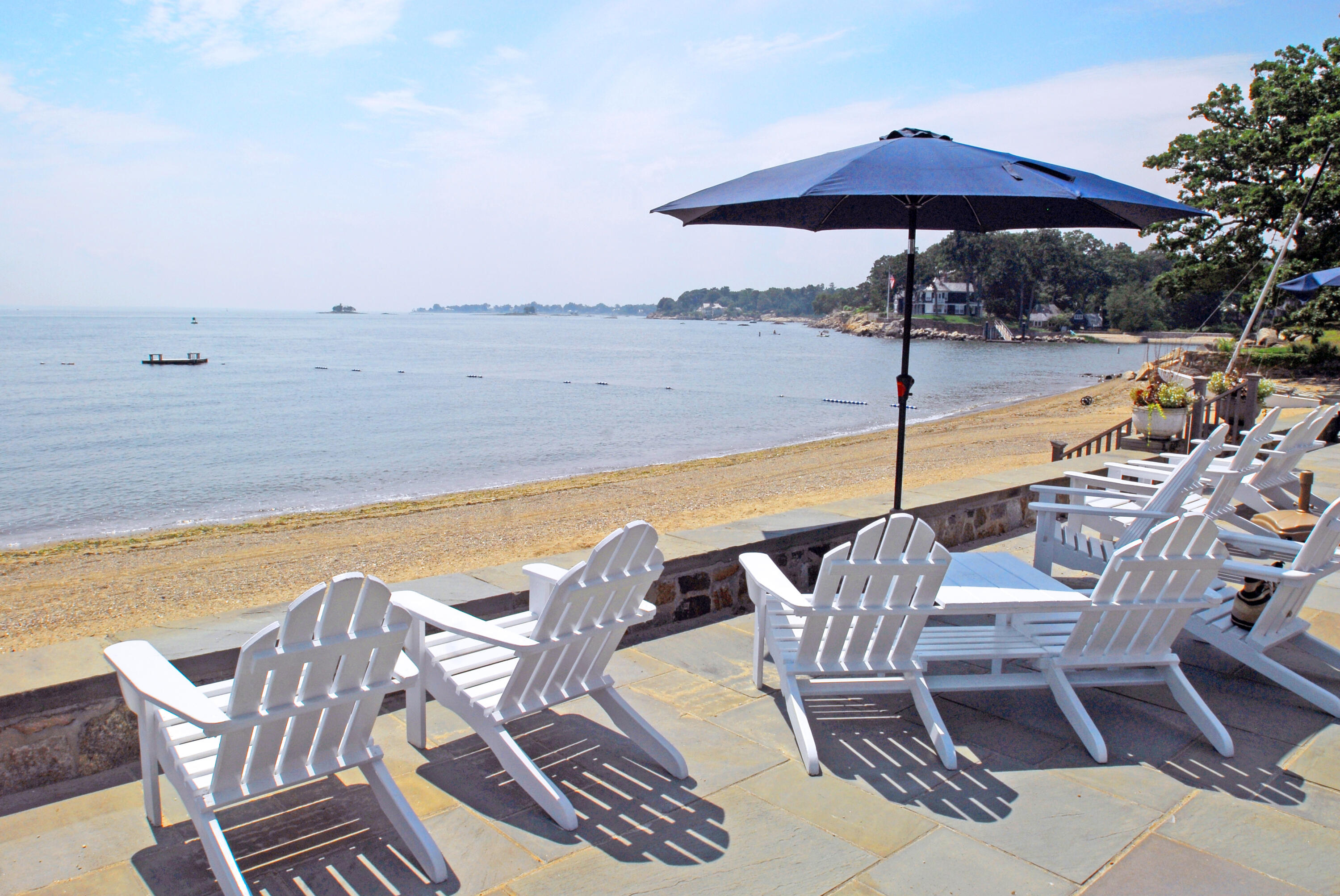90 Roton Avenue Norwalk, CT 06853 - Photo 29 of 33 a view of a patio with swimming pool table and chairs