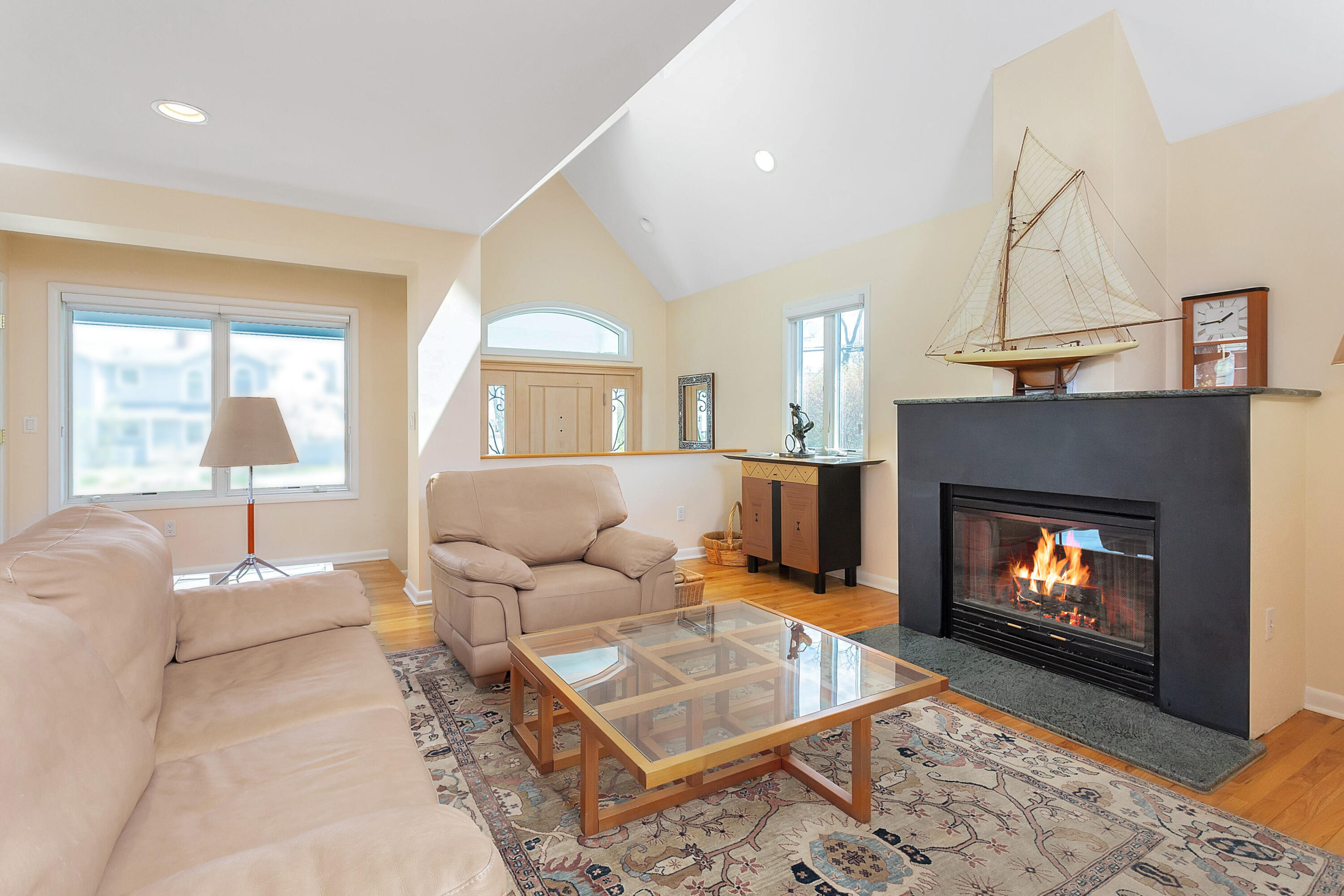 90 Roton Avenue Norwalk, CT 06853 - Photo 9 of 33 a living room with furniture and a fireplace