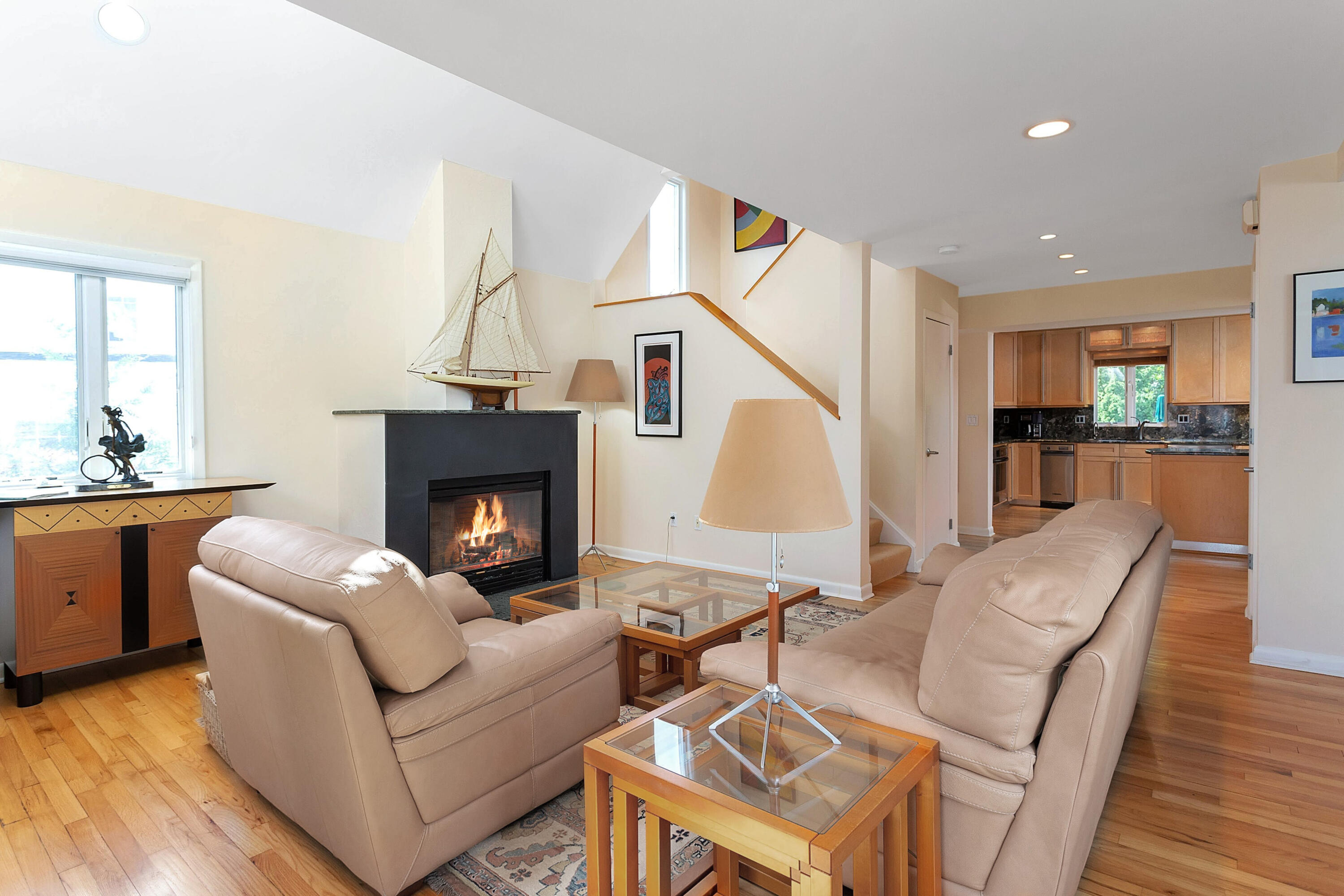 90 Roton Avenue Norwalk, CT 06853 - Photo 10 of 33 a living room with furniture a fireplace and a table