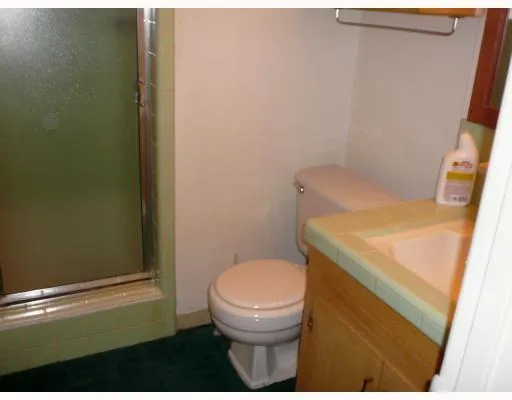 a bathroom with a toilet and a sink