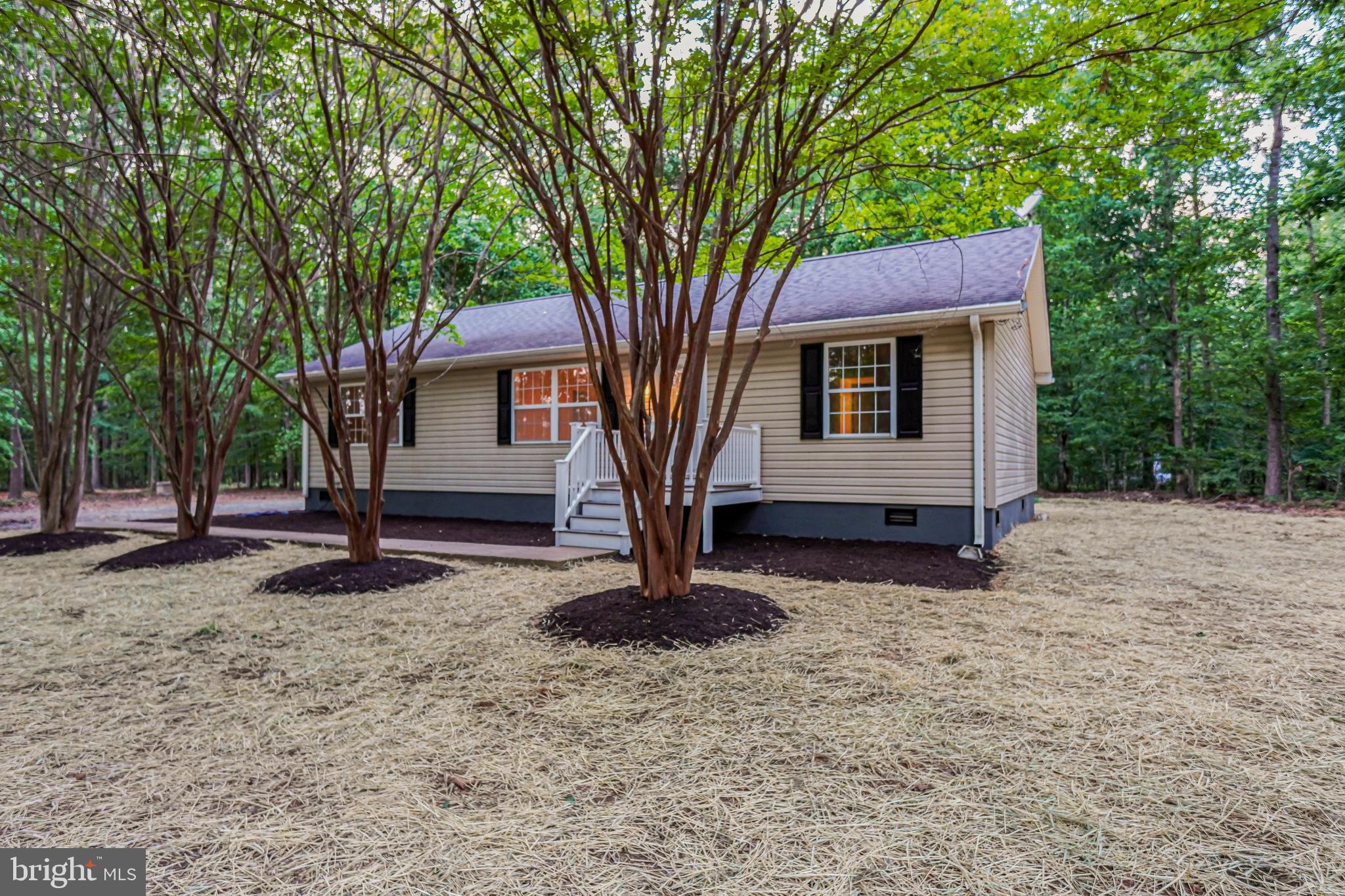 767 Loving Road Zion Crossroads, VA 22942 - Photo 2 of 33 a house that has a tree in front of the house