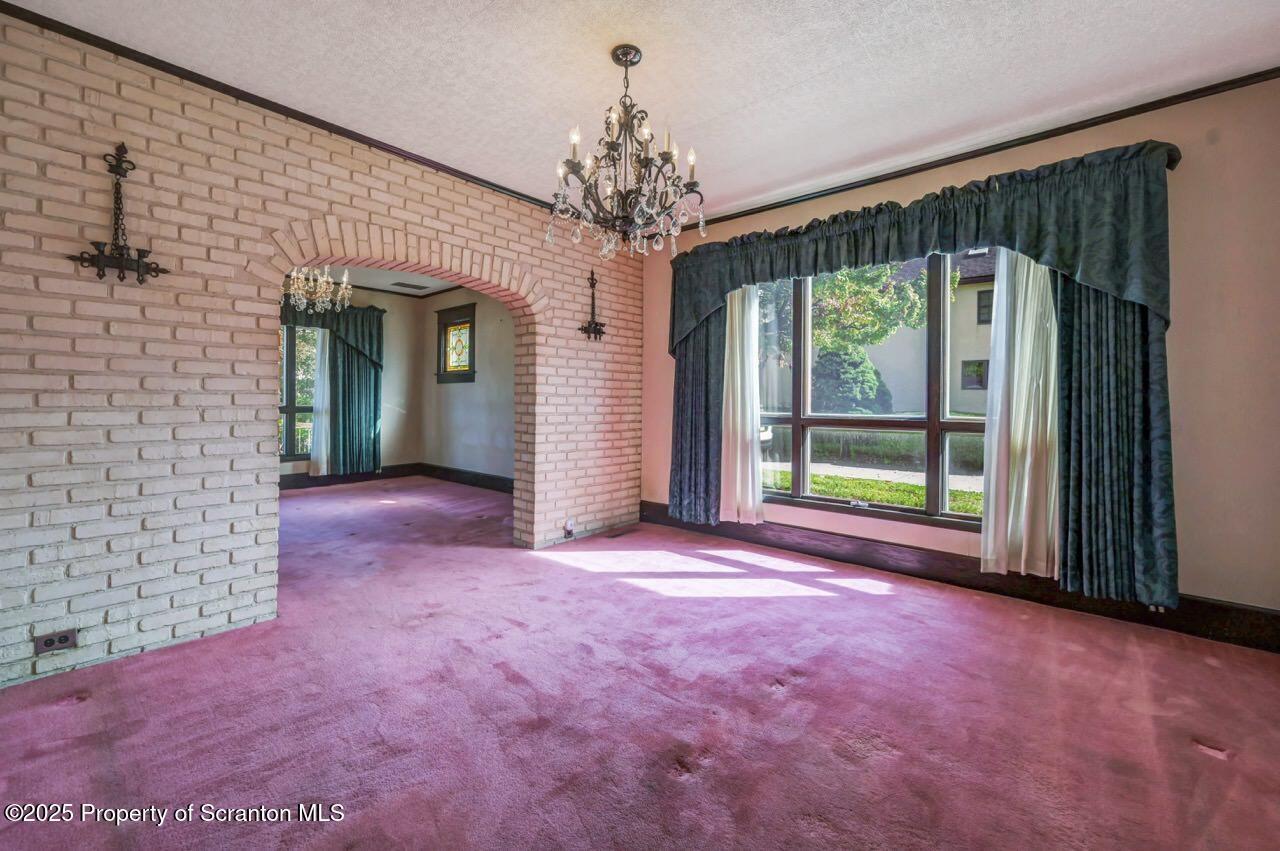 624 Main Street Moosic, PA 18507 - Photo 21 of 78 en empty room with windows and outdoor view