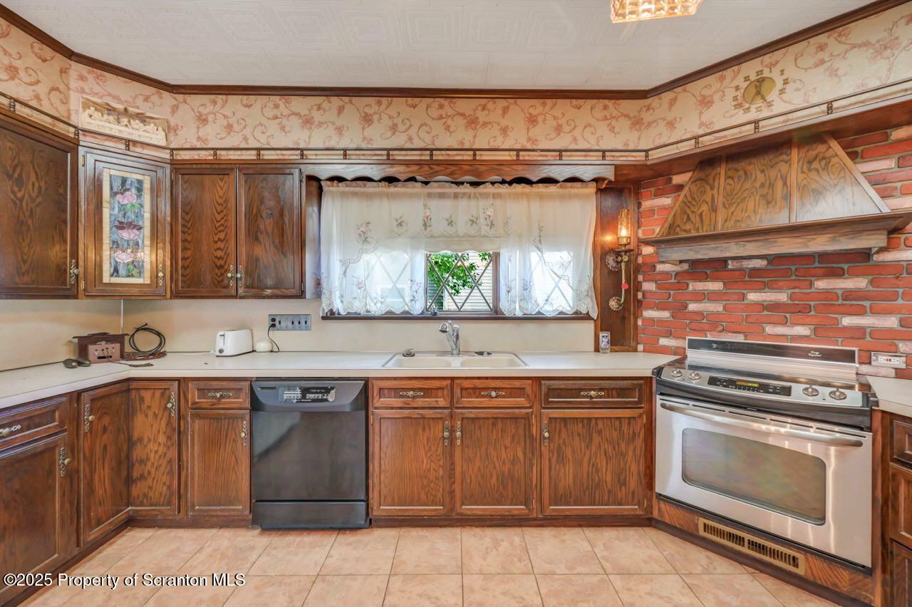 624 Main Street Moosic, PA 18507 - Photo 26 of 78 a kitchen with a sink stove and cabinets