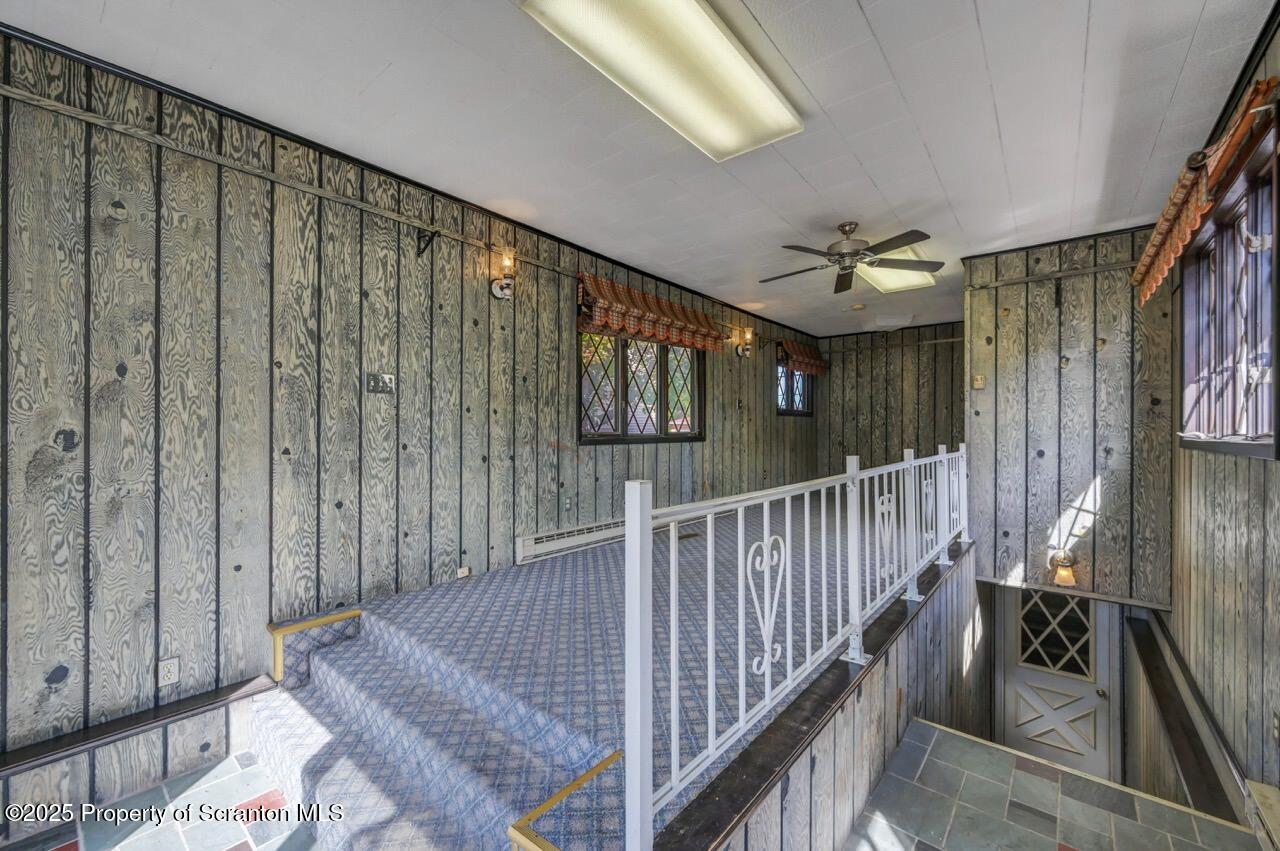 624 Main Street Moosic, PA 18507 - Photo 29 of 78 a view of staircase with railing and a chandelier