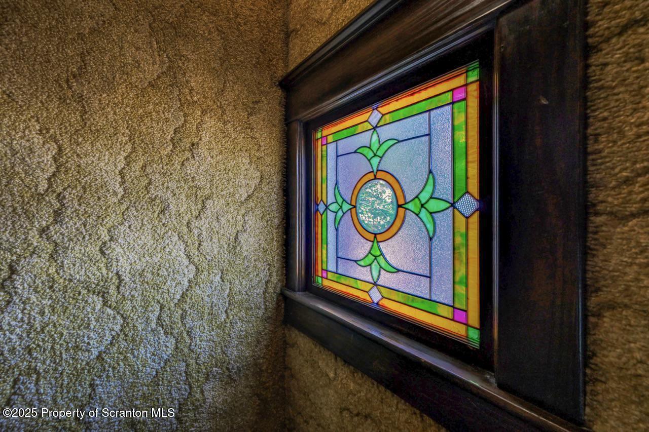 624 Main Street Moosic, PA 18507 - Photo 33 of 78 a sign on the wall next to a blue wall