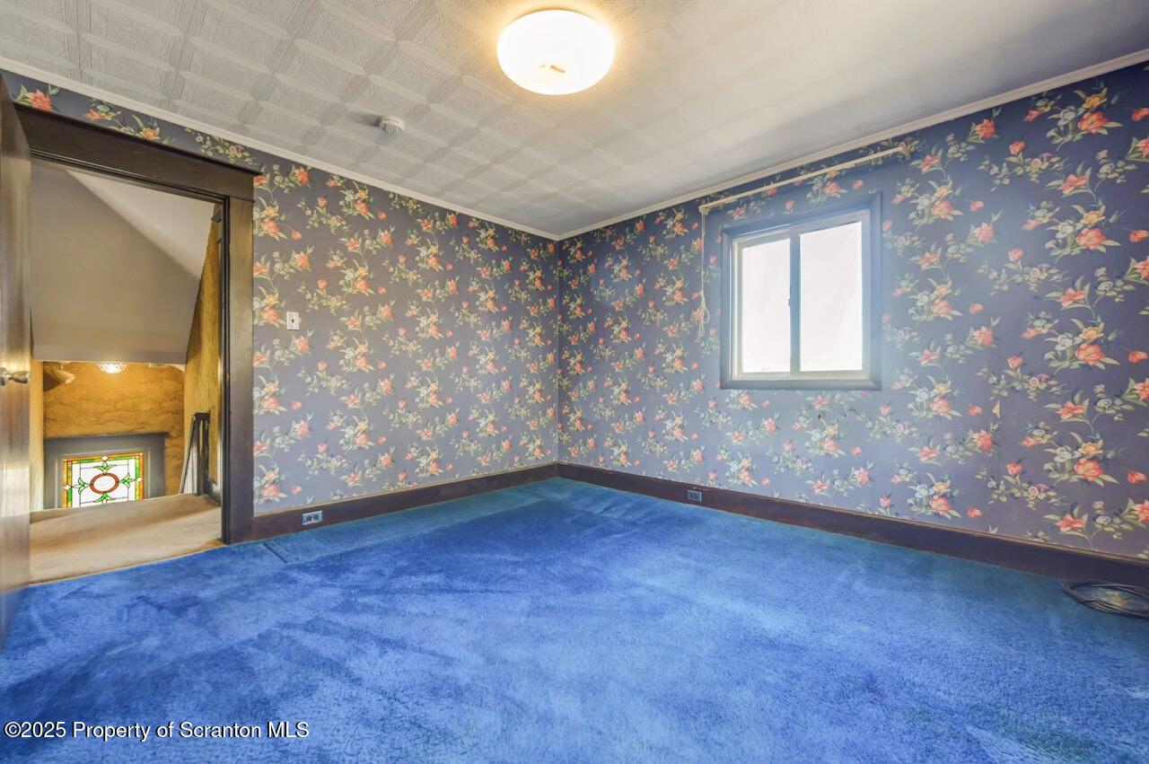 624 Main Street Moosic, PA 18507 - Photo 35 of 78 a view of an empty room with a window and wooden floor