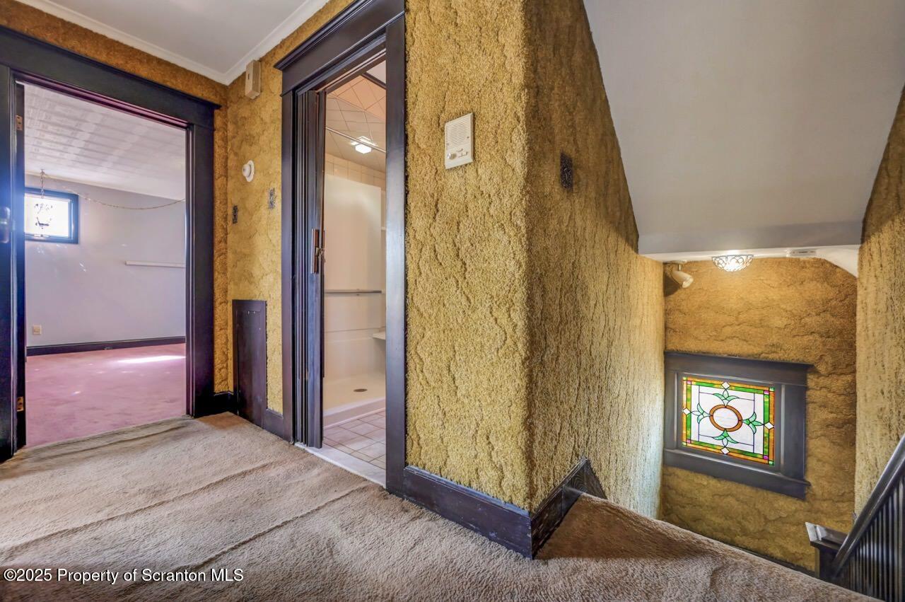 624 Main Street Moosic, PA 18507 - Photo 36 of 78 a living room with a couch and a dresser next to a window