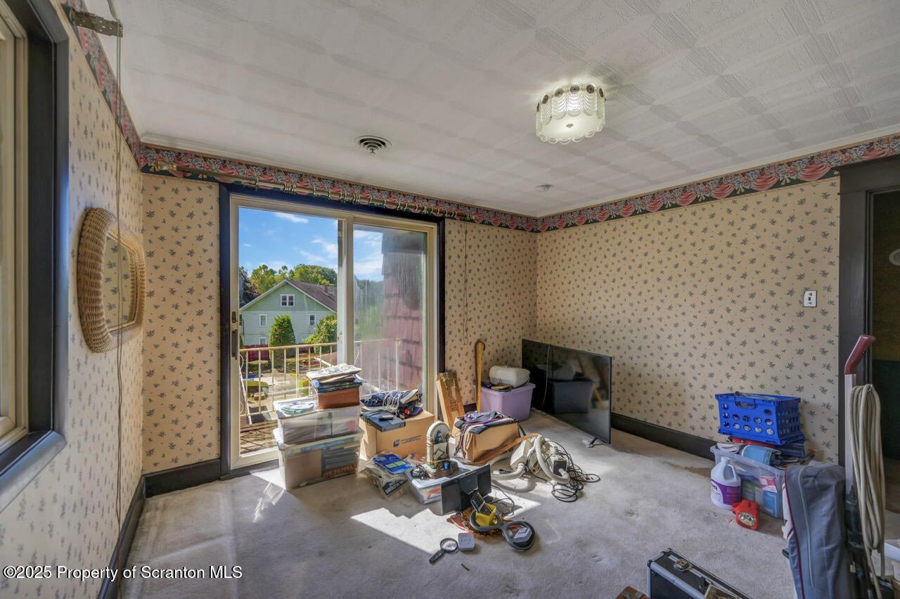 624 Main Street Moosic, PA 18507 - Photo 44 of 78 a living room with furniture and a flat screen tv