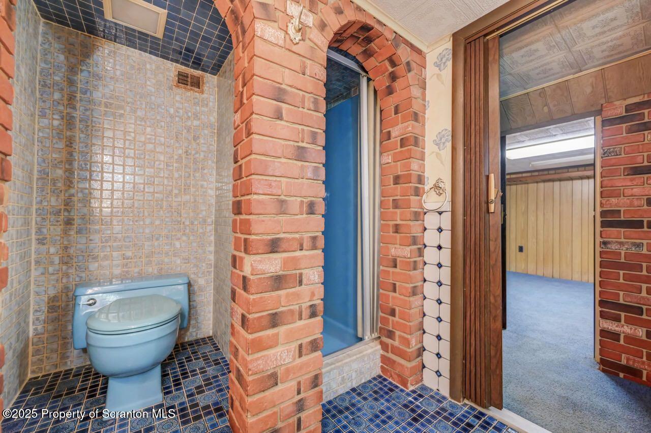 624 Main Street Moosic, PA 18507 - Photo 49 of 78 a bathroom with a toilet and a shower