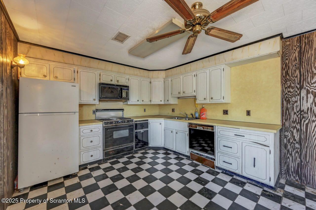 624 Main Street Moosic, PA 18507 - Photo 62 of 78 a kitchen with stainless steel appliances a stove a sink and a refrigerator