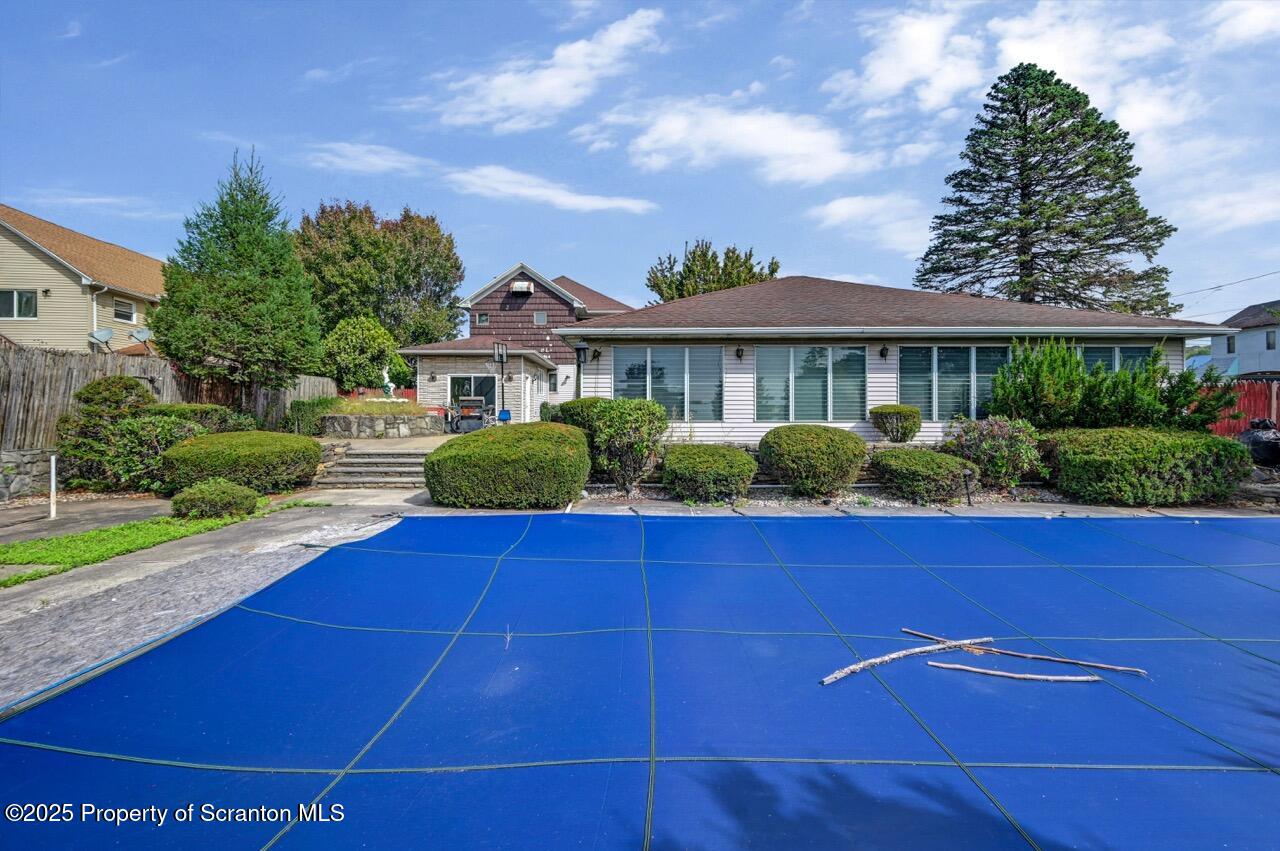 624 Main Street Moosic, PA 18507 - Photo 9 of 78 a front view of a house with garden
