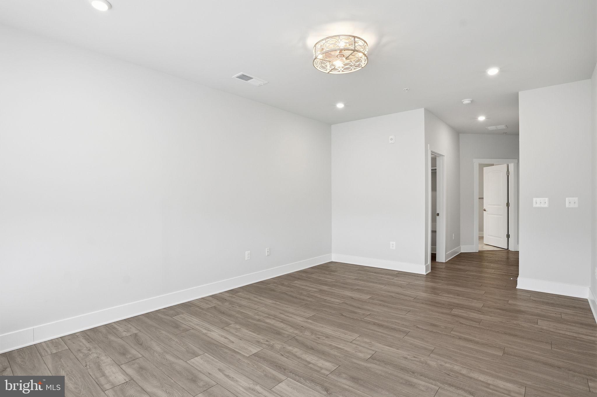 111 Marshgrass Way, Unit 22 Chester, MD 21619 - Photo 17 of 102 a view of an empty room with a window