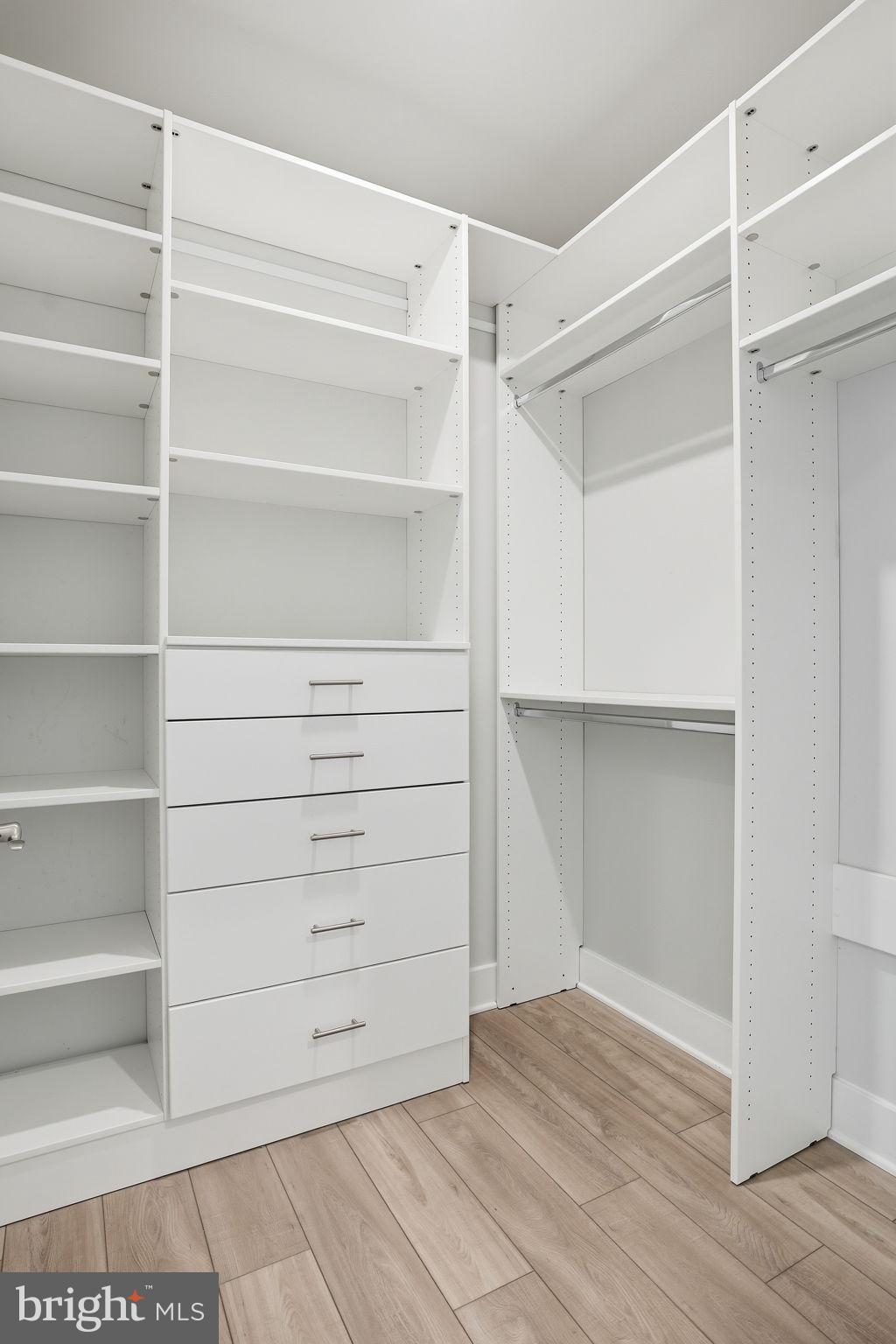111 Marshgrass Way, Unit 22 Chester, MD 21619 - Photo 21 of 102 a view of walk in closet with empty racks