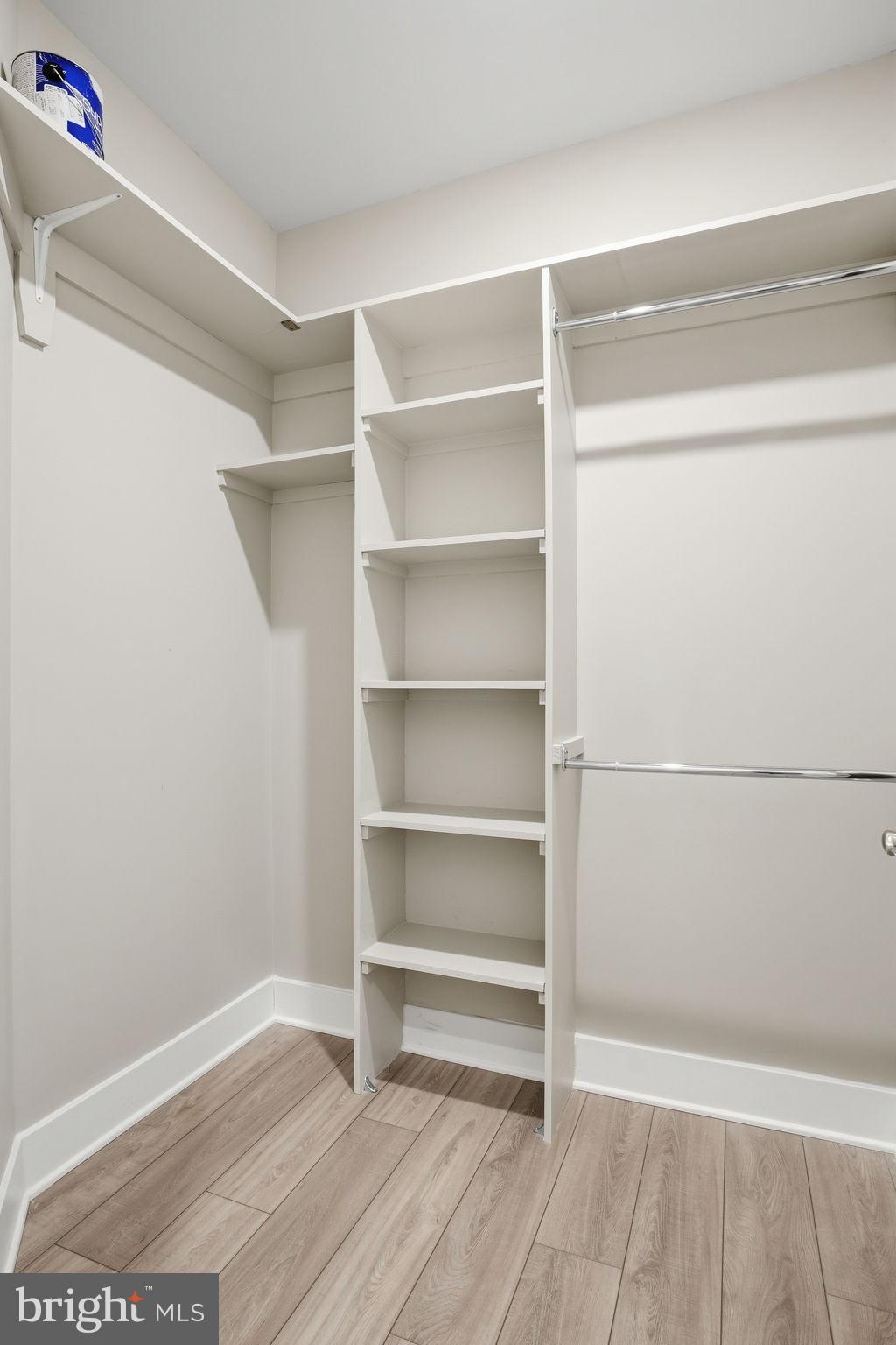 111 Marshgrass Way, Unit 22 Chester, MD 21619 - Photo 25 of 102 a view of walk in closet with empty racks