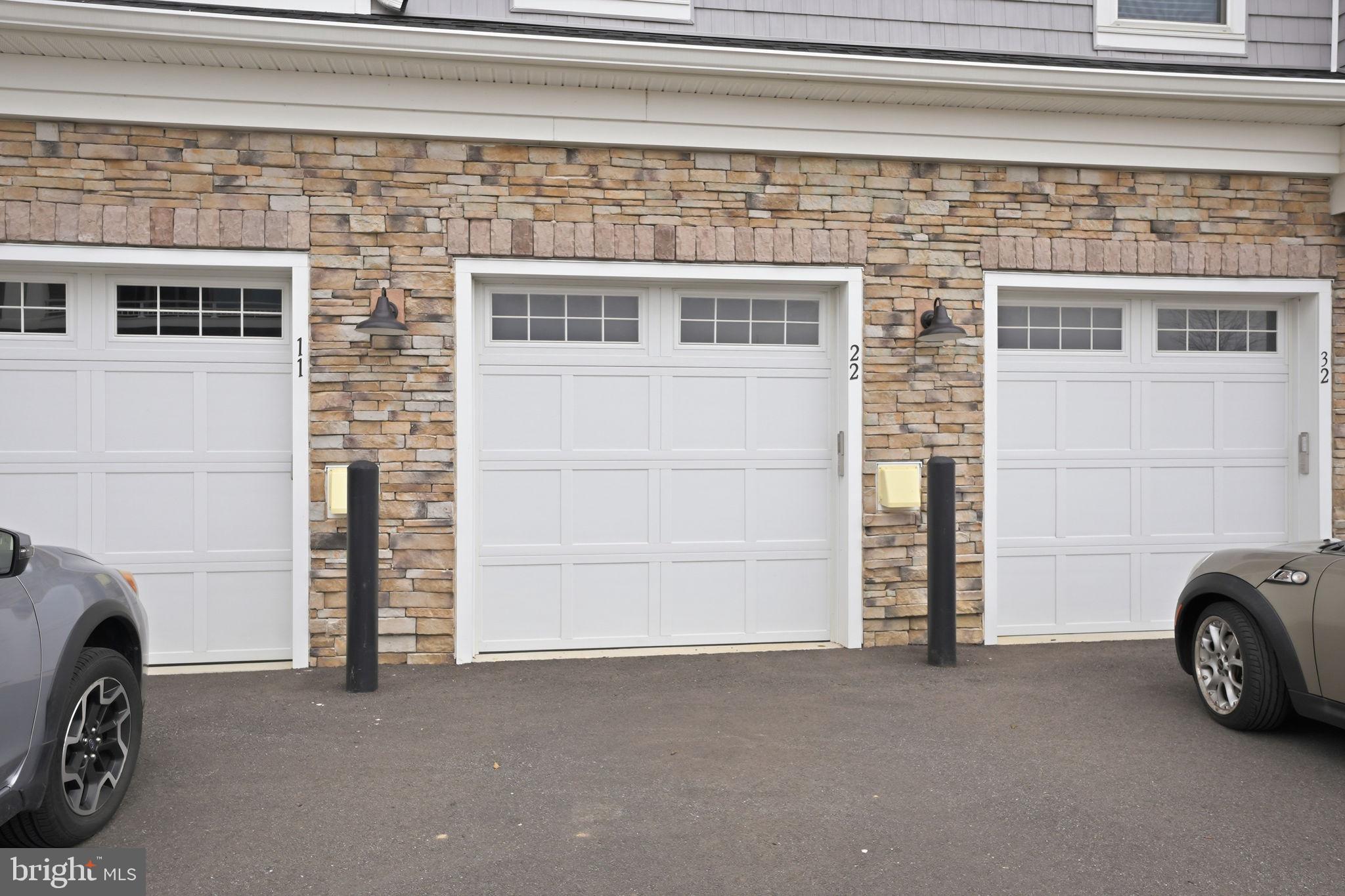 111 Marshgrass Way, Unit 22 Chester, MD 21619 - Photo 34 of 102 a view of a car garage and a car parked in garage