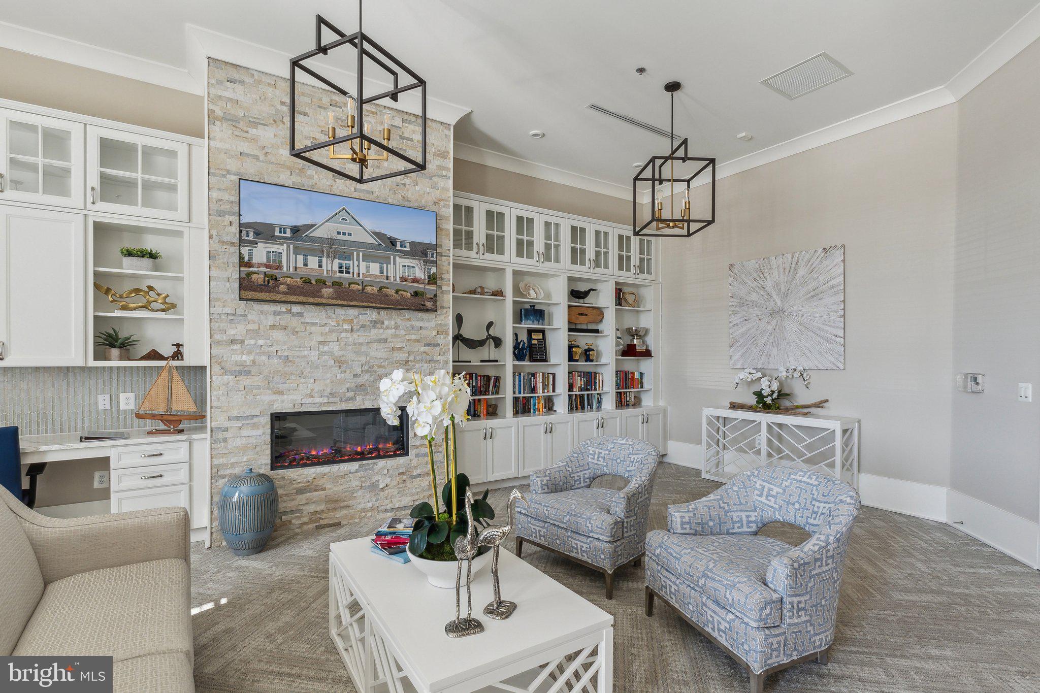 111 Marshgrass Way, Unit 22 Chester, MD 21619 - Photo 43 of 102 a living room with furniture wooden floor and a chandelier