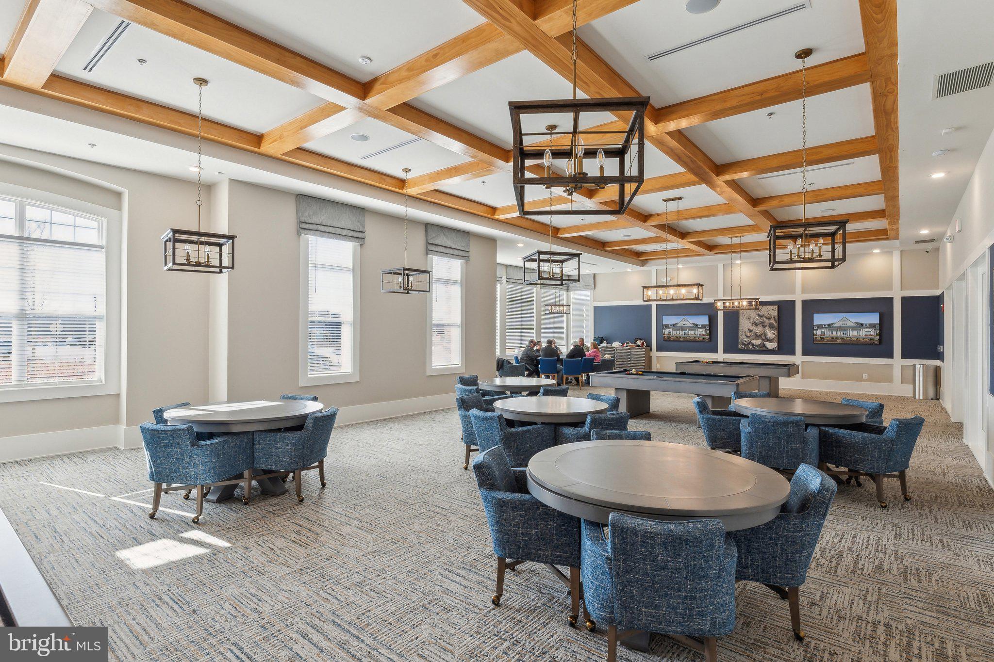 111 Marshgrass Way, Unit 22 Chester, MD 21619 - Photo 46 of 102 a living room with a couch and a table
